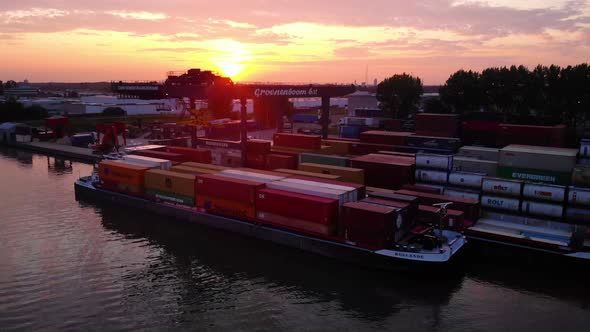 Golden Hour Sunset At The Port Of Alblasserdam In Netherlands With Container Vessel Anchored For Loa