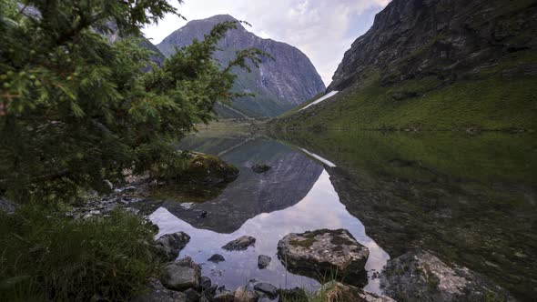 Time Lapse of Norwegian Alpine Lake with Reflection shot on Slider.Stavbergvatnet, Norangsdalen, No