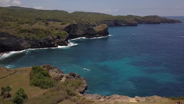 Unbelievable aerial view flight slowly sinking down drone shot in front of natural bridgeBroken Bea