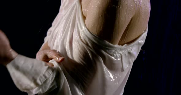 Sexy Woman Is Getting Wet in the Rain in Dark Street, Close-up Moving Shot