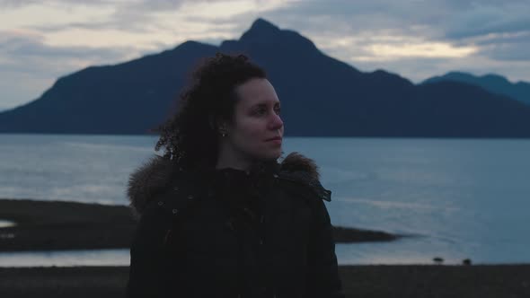 Adventurous Adult Woman Taking in the View of Pacific Ocean Coast