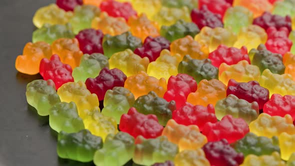 Full Frame Looped Spinning Background of Colorful Jelly Bear Candies