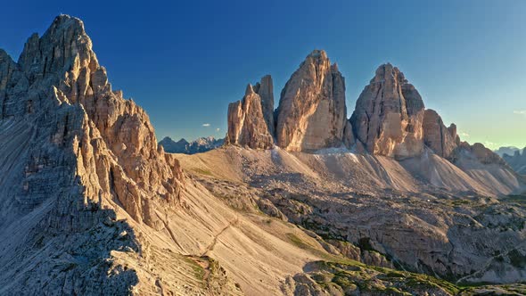 Aerial view of mountain shelter above Tre Cime at sunset