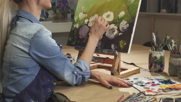 Cropped Shot of a Smiling Female Artist Drawing Flowers at Her Art Studio