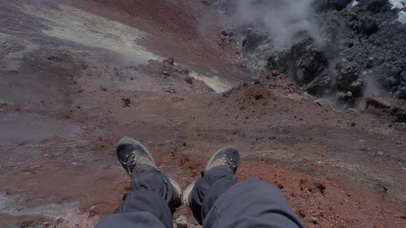 Upper View on Man's Feet in Hiking Boots at Caldera of Avachinsky Stratovolcano Also Known As Avacha