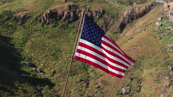 USA Flag on a Flagpole.  Aerial of the American Flag Is Fluttering on a Wind