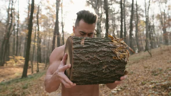 Young Man Doing Exercises In The Forest.