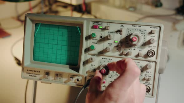 Turning knob and manipulating a highly sophisticated electronic vintage device