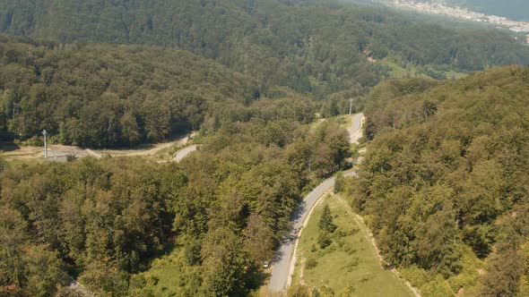 Aerial view of a road in the forest in Transylvania