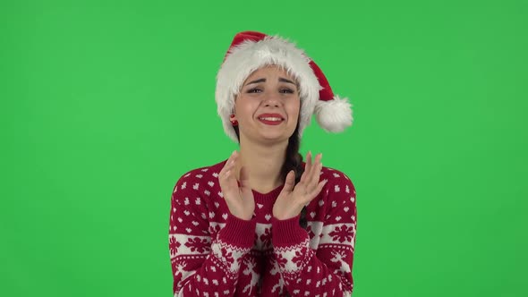 Portrait of Sweety Girl in Santa Claus Hat Is Looking with Tenderness . Green Screen