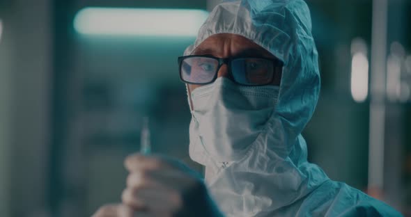 Doctor with Syringe Working in Hospital