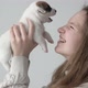 Girl Petting and Playing with a Small Puppy - VideoHive Item for Sale