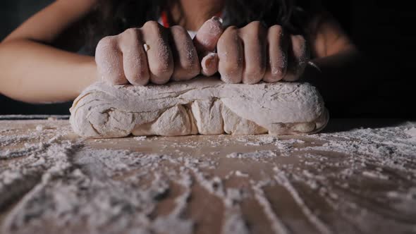 Female Hands Gently Knead the Dough Closeup in Slow Motion