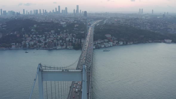 Big Bridge Leading Into the City Skyline, Car Traffic at Sunset in Istanbul, Aerial Dolly Slide Left
