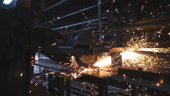 Worker in Safety Protection Wear Use Saw Cutting Machine to Cut Metal