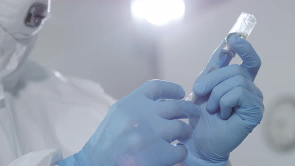 Medical Scientist Filling Syringe