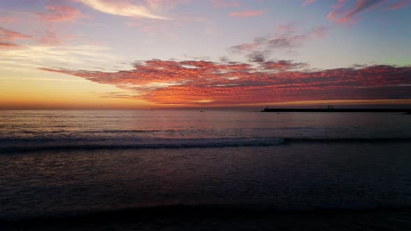 Wonderful Sunset with Ocean Waves on Empty Sandy Beach