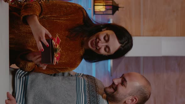 Vertical Video Man Giving Present to Woman for Christmas Celebration