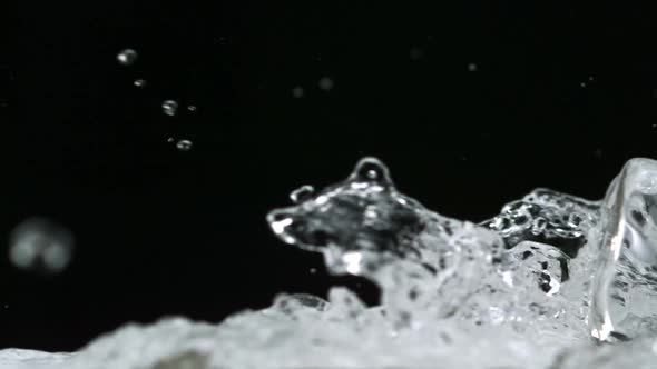 Water splash and ice cube, Slow Motion