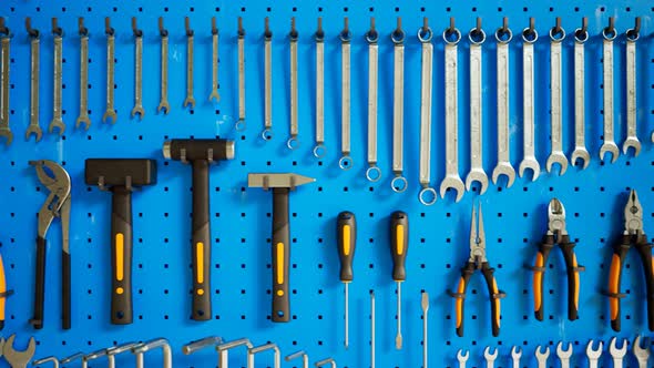 Garage tools hanging on the organizer wall. Loopable animation. Workshop. 4K HD