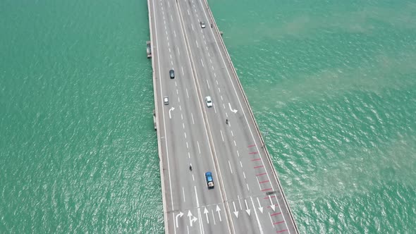Aerial view of Penang Bridge Malaysia with traffic lanes in both directions, drone bird's eye view o