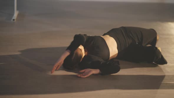 Young Slim Sensual Woman Lying Down on Floor and Standing Up in Slow Motion Rehearsing Modern