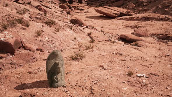 Ancient Statue on the Rocks Desert