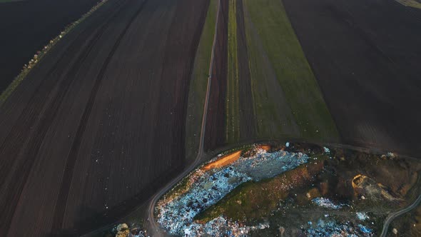 Aerial View of the Garbage Truck Near the Agricultural Lands