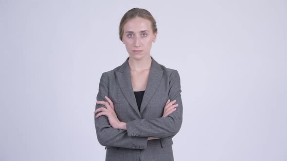 Young Beautiful Blonde Businesswoman with Arms Crossed