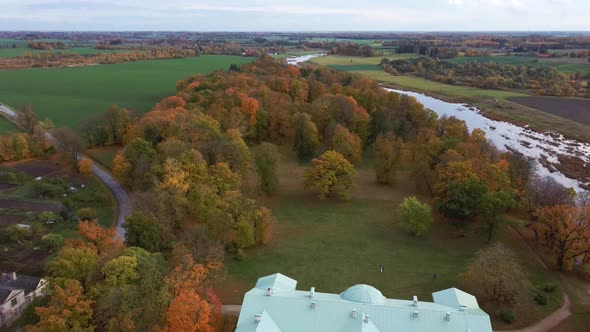 Autumn Aerial Landscape of the City Mezotne and Palace With Park Near Lielupe River, Latvia 4K Video