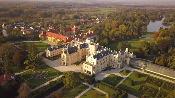 Aerial view of small town Lednice and castle yard with green gardens in Moravia, Czech