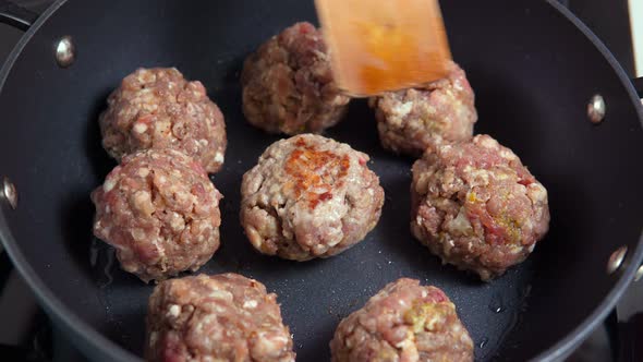 Minced Pork Meatballs are Mixed with Ground Beef in a Frying Pan