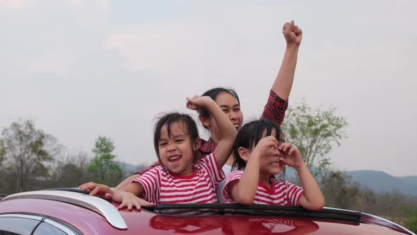 Happy family enjoying road trip on summer vacation.