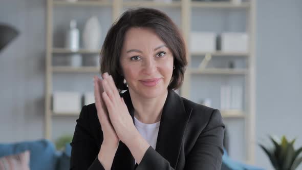 Portrait of Applauding Beautiful Old Businesswoman Clapping