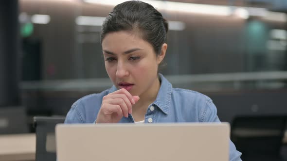 Close Up of Indian Woman Coughing While Using Laptop
