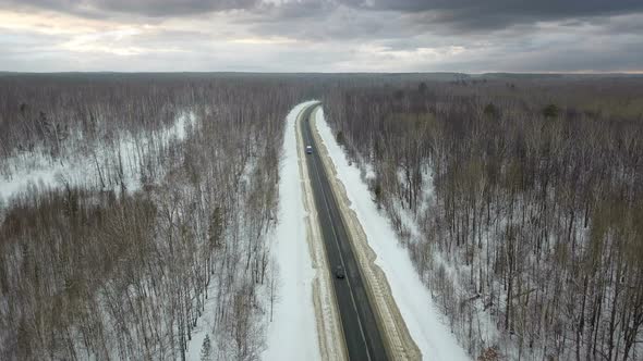 Winter Road And Cloudy Sky