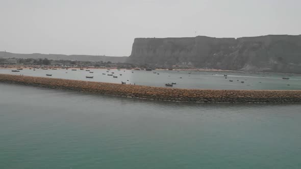 Aerial rotating drone shot of Makran Coastal Highway along Pakistan's Arabian Sea coast from Karachi