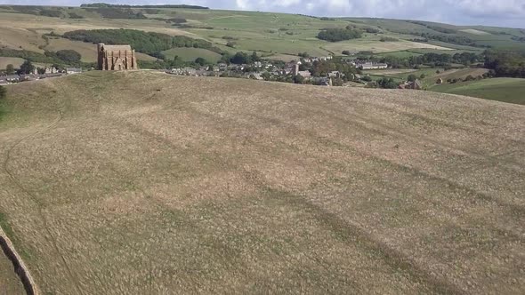 Aerial tracking forward above St Catherine's Chapel, near Weymouth. Rising above to reveal the villa