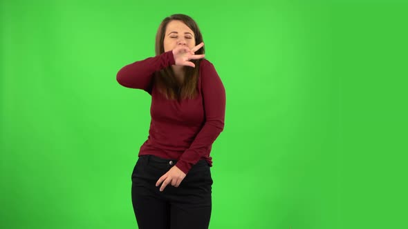 Pretty Girl Is Smiling and Dancing Funny. Green Screen