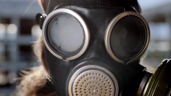 Close Up Eye of Woman in Gas Mask Who is Being Blown Up By Smoke