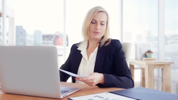 Businesswoman working on laptop