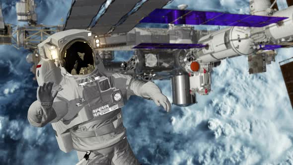 Astronaut Spacewalk, Waving His Hand in the Open Space