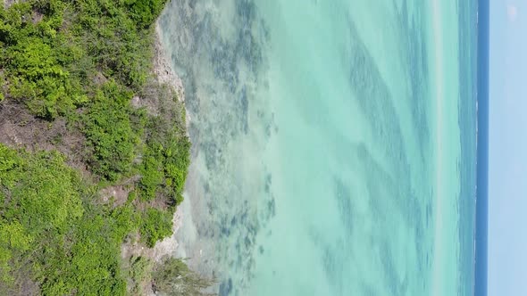 Vertical Video of the Ocean Near the Coast of Zanzibar Tanzania Aerial View