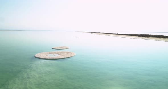 Aerial view of circle salt formation in the water. Dead sea, Negev, Israel.