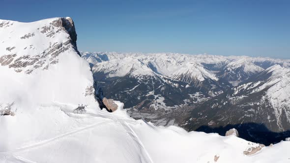 Flight over snow-covered mountain ridge