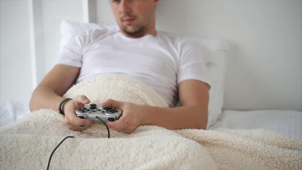 Close Up Shot of the Men's Hands, Who Uses the Console for the Game Console