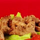 Pieces of Meat in a White Plate on Lettuce Leaves and Cherry Tomatoes in a White Plate on a Red - VideoHive Item for Sale