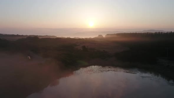 Beautiful Sunrise Above Peatbog in County Donegal with Fog  Ireland