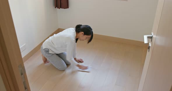 Asian Housewife woman wash the floor with rag