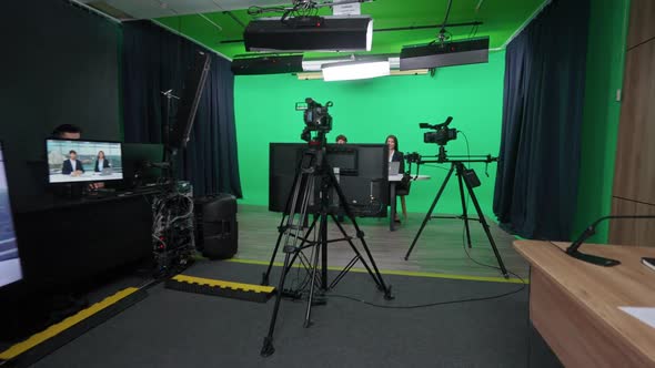 Multicam Live Broadcast News Anchors at Work View of a Backstage Studio TV News Shooting Interview